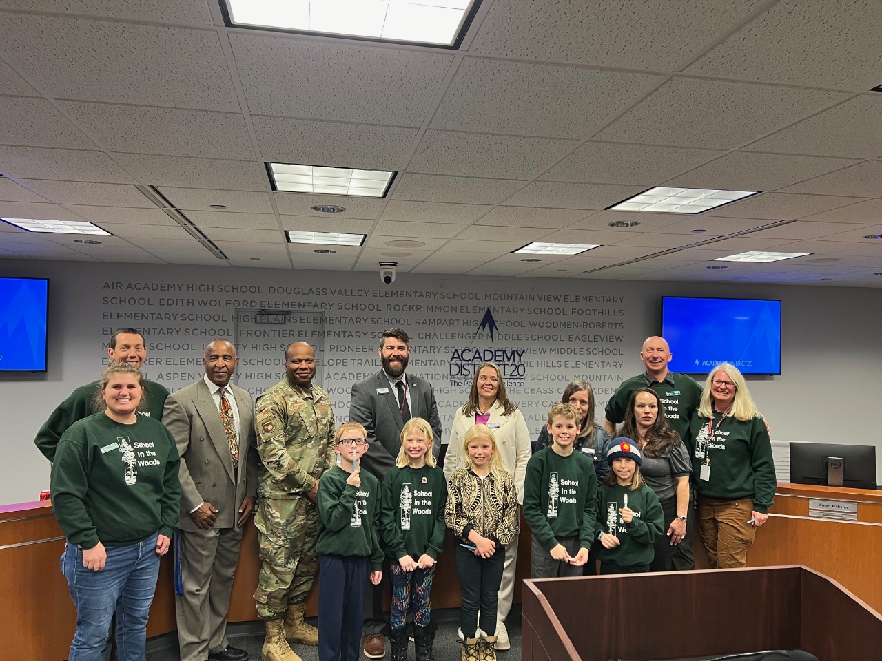 Staff and students from School in the Woods and the Board of Education.